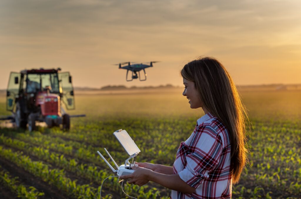 pretty-young-farmer-woman-driving-drone
